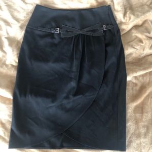MAAKIF classic black skirt. Unique Buckle detail in front feels like leather.